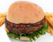 One barbecue trick is to pre-cook and wrap the burger in tinfoil