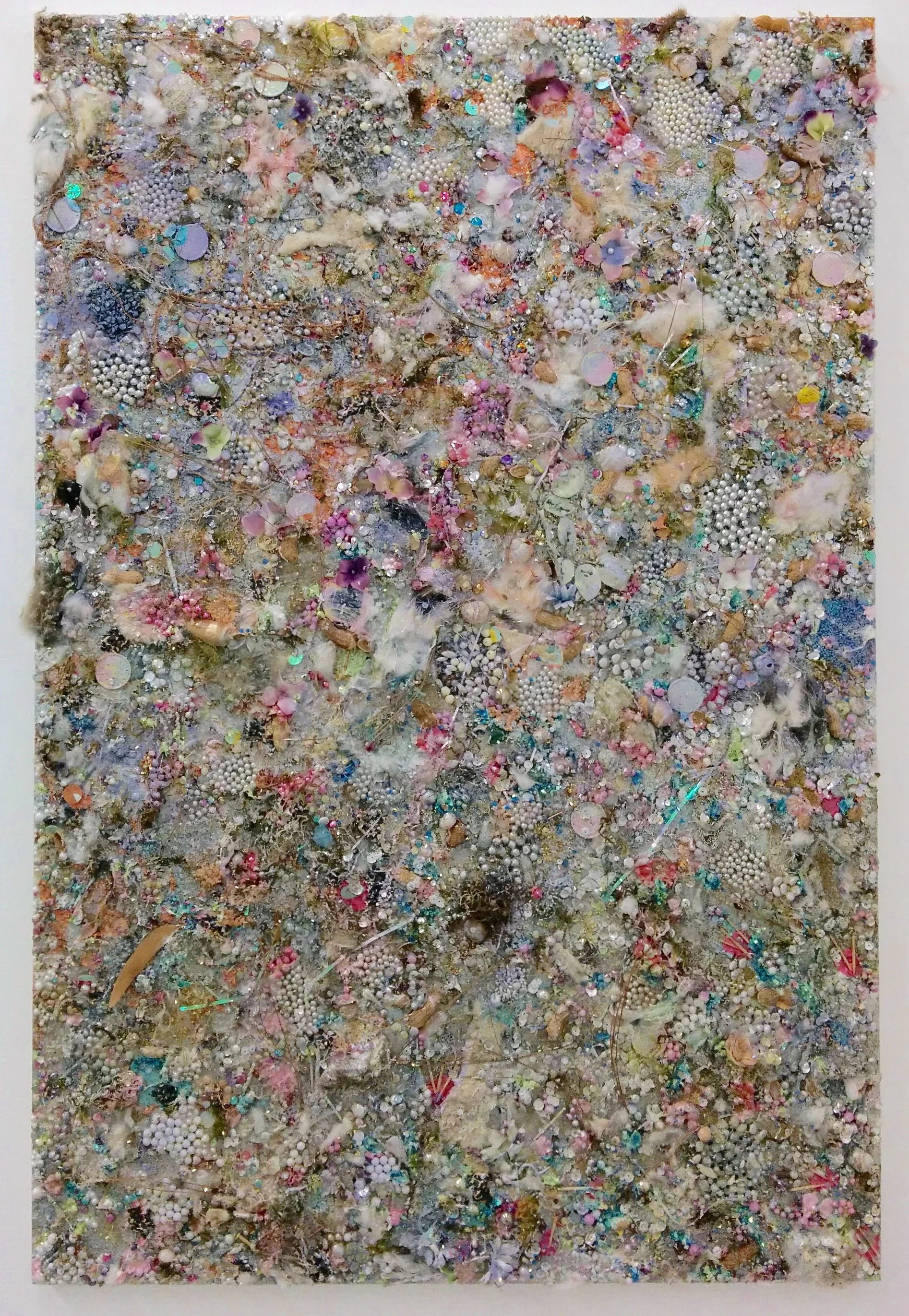 Diary Entry, November 2016, Pine needles, snail shells, fur, beads, pistachio shells, money, matches, feathers, moss, paper, lenses, glitter, teeth, acrylic medium on wood panel 32” x 46”