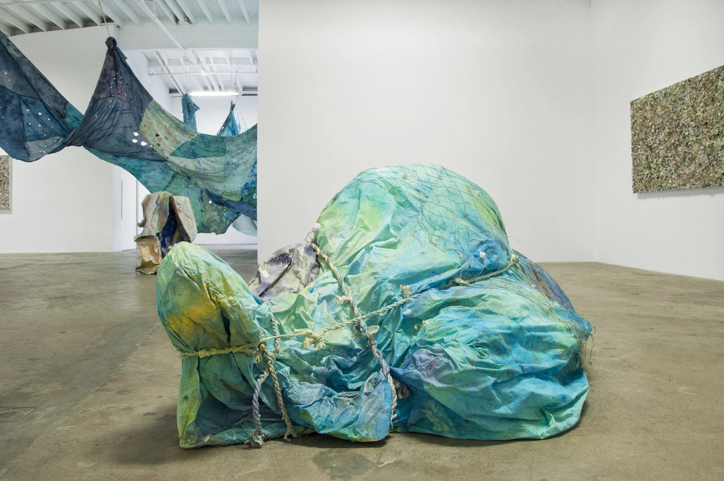 Kitty Rock IV, materials: inkjet print on polyester, bed sheets, batting, cotton, moss, rope, glue, acrylic paint, steel armature 80” x 64” x 36”