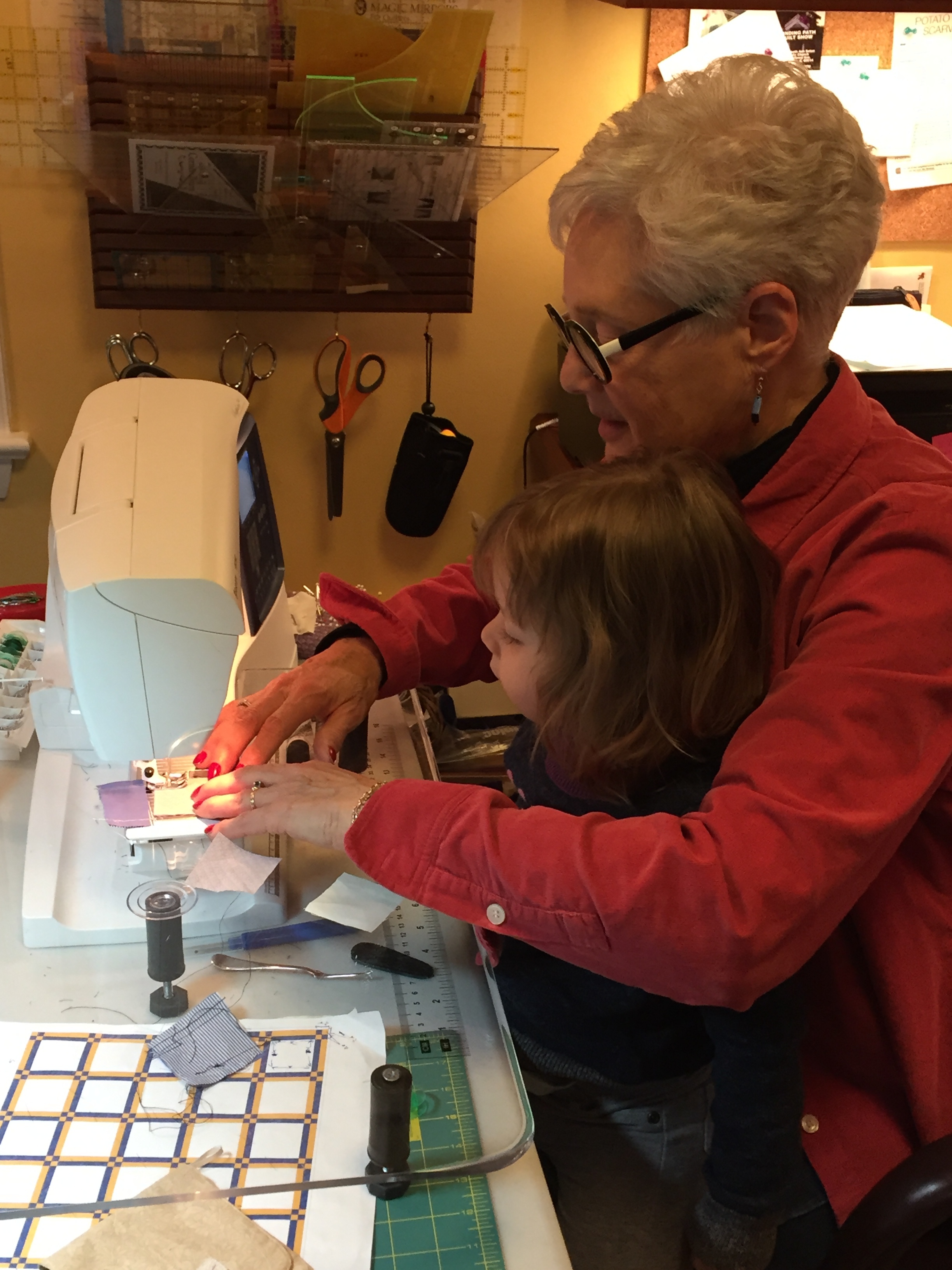 Linda sewing with her 2 1/2 year old. In Linda's words, "This is what it's for!"