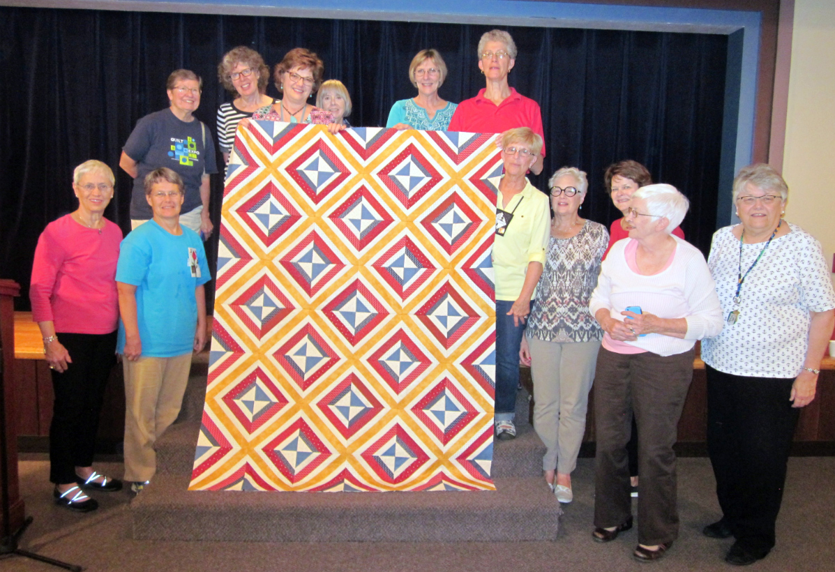 The quilt of valor top with the group who stayed to the end, minus those taking pictures!