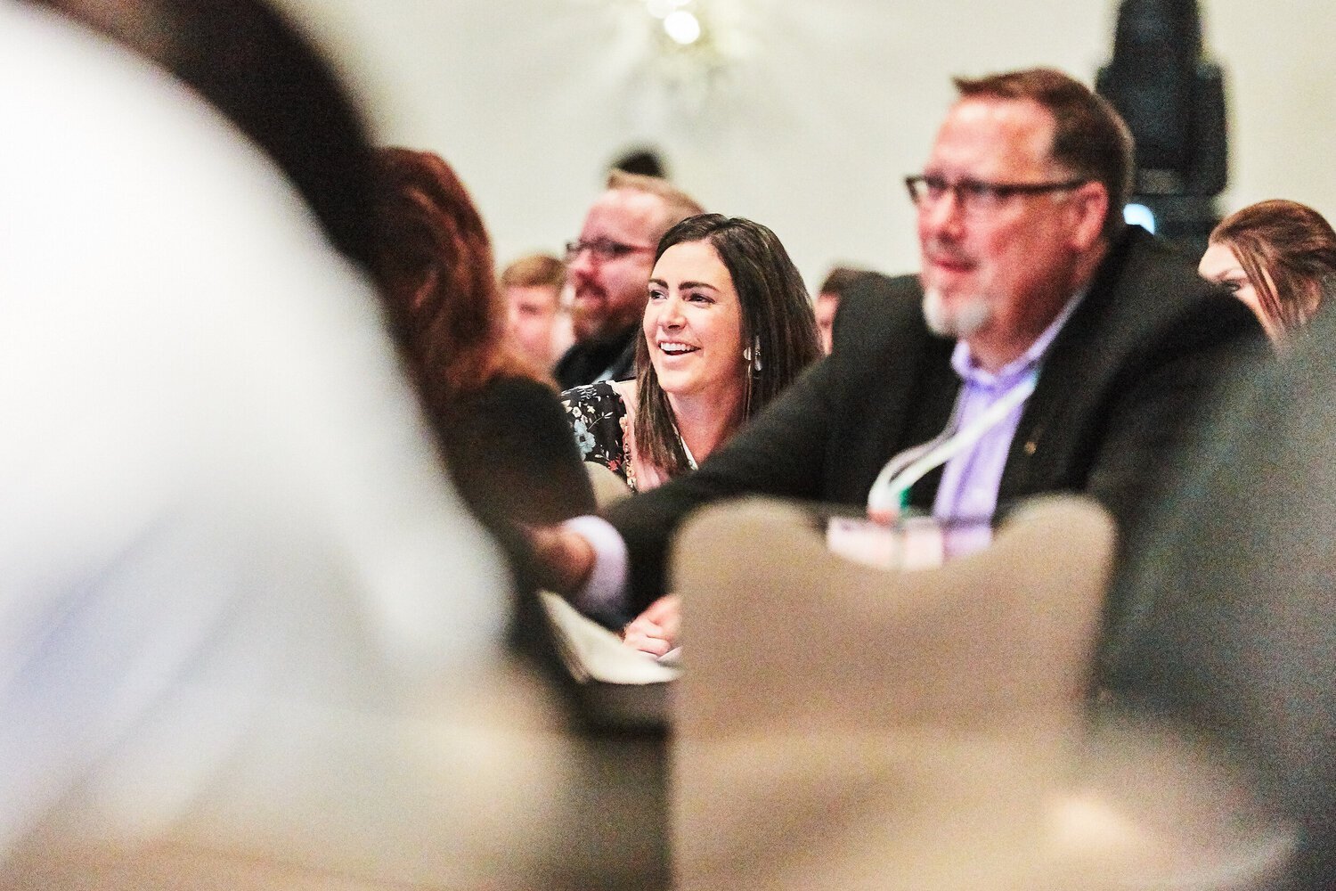 Conference+attendees+laughing+reacting+to+speaker.jpg