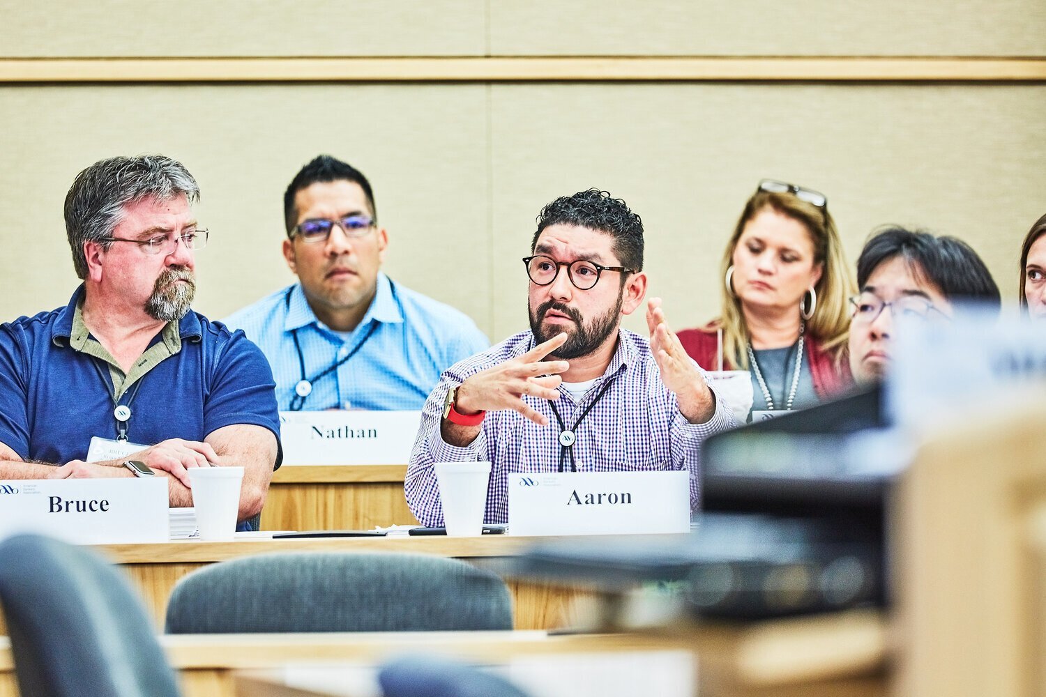 Man+speaking+with+hands+at+breakout+session.jpg