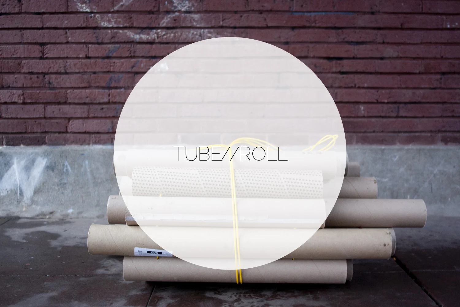  This wearable pack of salvaged cardboard tubes provides portable protection between a body and the ground. As a DIY hack, the object functions as ground cover and thermal barrier between cold pavement and someone sleeping in the urban outdoors.