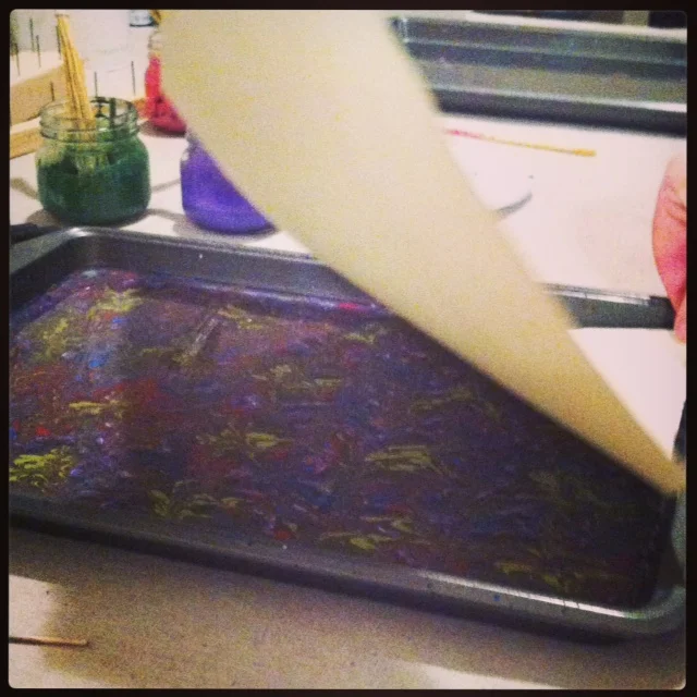 Lifting paint from size to paper.