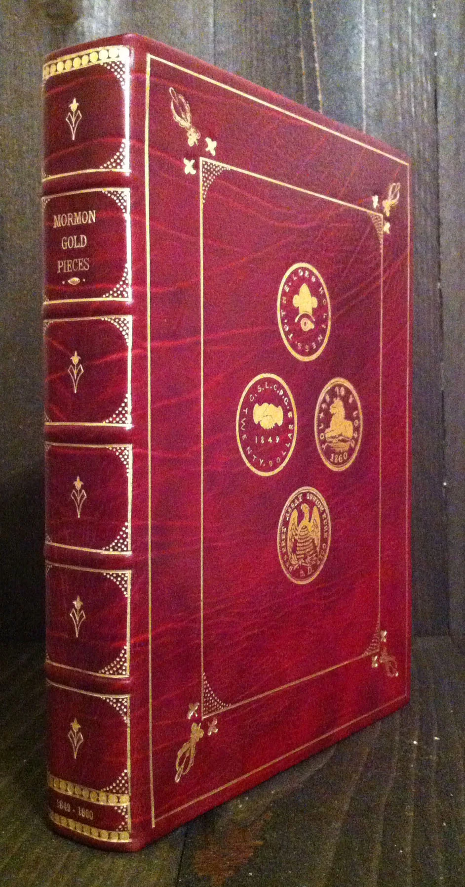 Presentation clamshell enclosure for six Mormon gold pieces.
