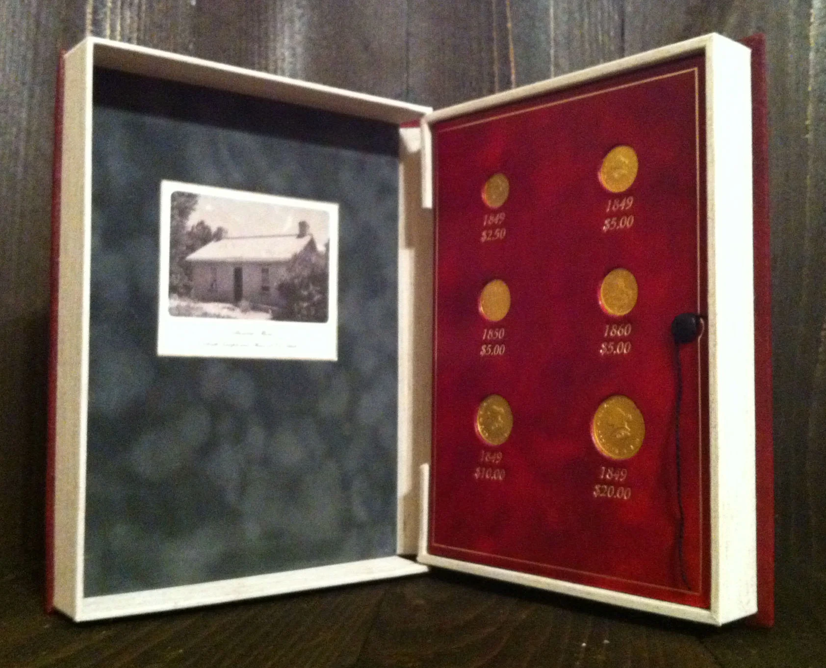 Inside cover of the presentation clamshell for the Mormon gold pieces.