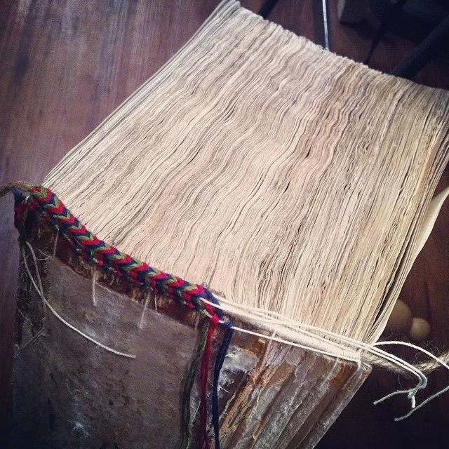 Hand embroidered endbands for the rebind of a 1611 King James Bible.