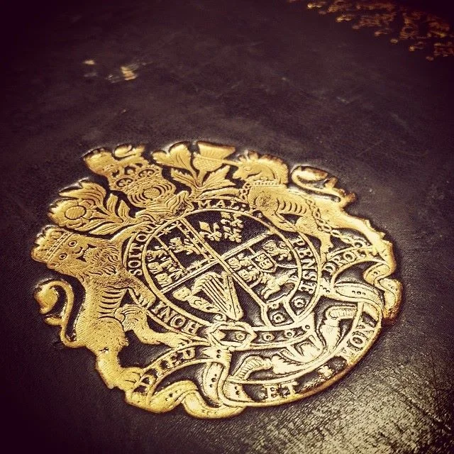 This is a Royal Supralibros on the cover of a 1753 King James Bible. This bible was personally owned by King George II. 