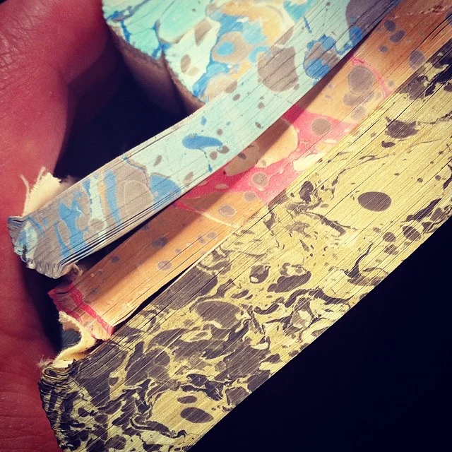 Stone marbled text blocks, edge treatments for some of our blank journals.