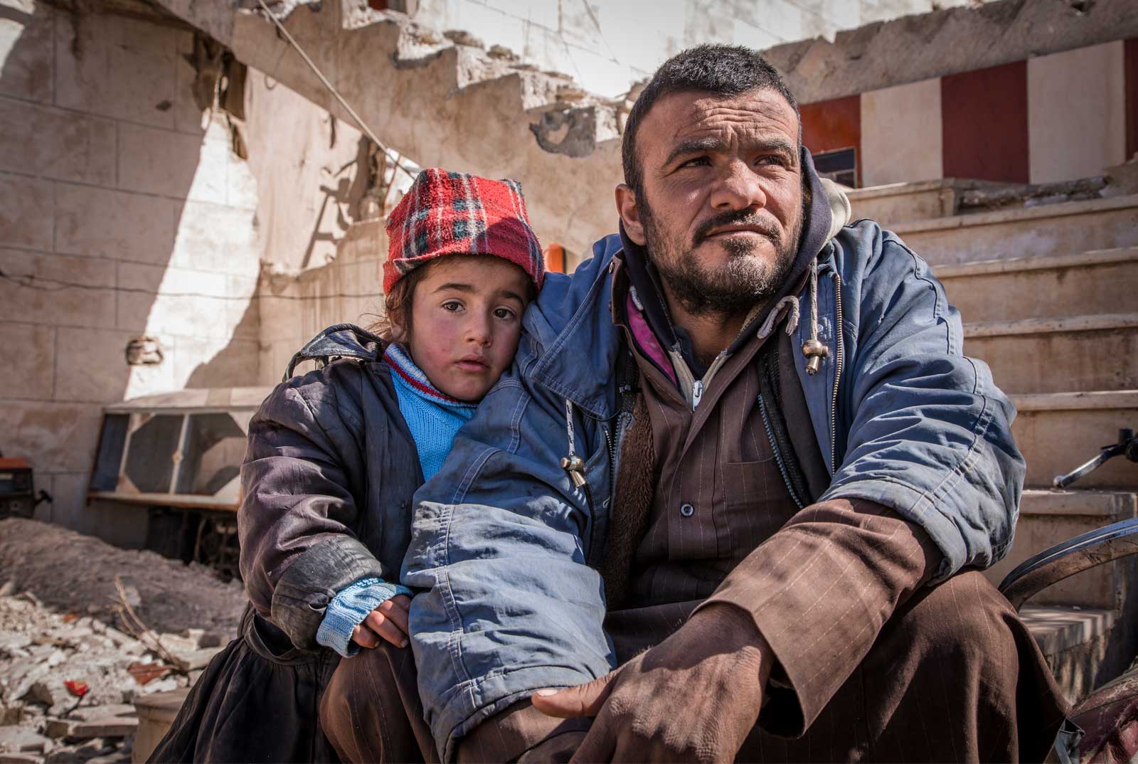 FIRAS* AND HIS FAMILY HAVE BEEN DISPLACED TWICE BY ISIS. THEY EVENTUALLY ATTEMPTED TO GO BACK TO THEIR HOMETOWN, TEL ABIAD, BUT WHEN THEY REACHED THEIR HOMES THEY FOUND THEM IN UNLIVEABLE CONDITIONS. THEY THEREFORE FOUND AN ABANDONED PETROL STATION NEARBY AND DECIDED TO LIVE THERE UNTIL THEY FIGURED OUT WHAT TO DO. FIRAS SAYS ONE OF HIS CHILDREN WITNESSED THE DEATH OF AN UNRELATED CHILD. HIS SLEEP IS NOW AFFECTED WITH NIGHTMARES THAT THE SAME WILL HAPPEN TO HIM. HE WAKES UP SCREAMING. HIS CHILD NOW TRIES TO STAY AWAKE DURING THE NIGHT AND SLEEPS DURING THE DAY. IMAGE BY SAVE THE CHILDREN