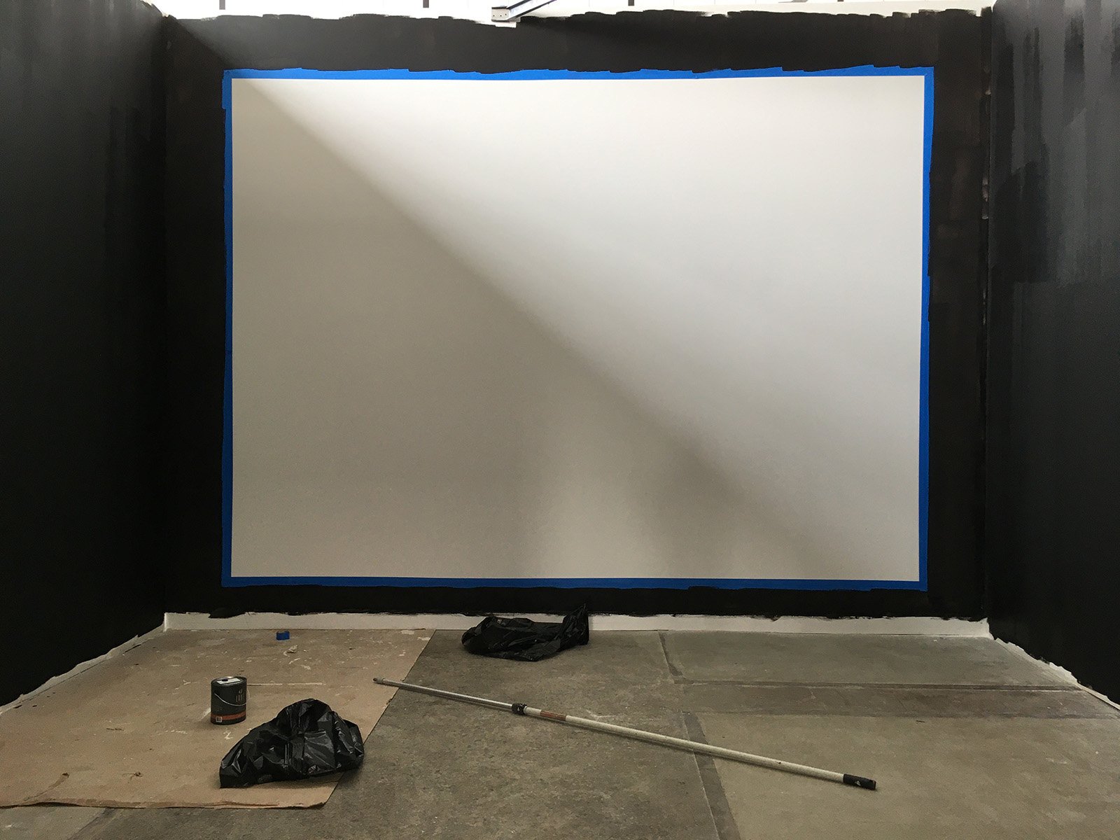  Preparing a gallery wall for a digital projection. 