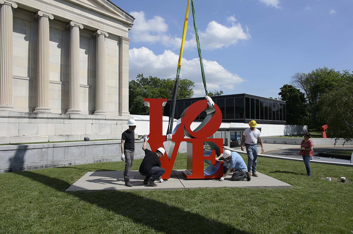  Lowering a Robert Indiana sculpture into place with a team of preparators, registrars, and contractors. 