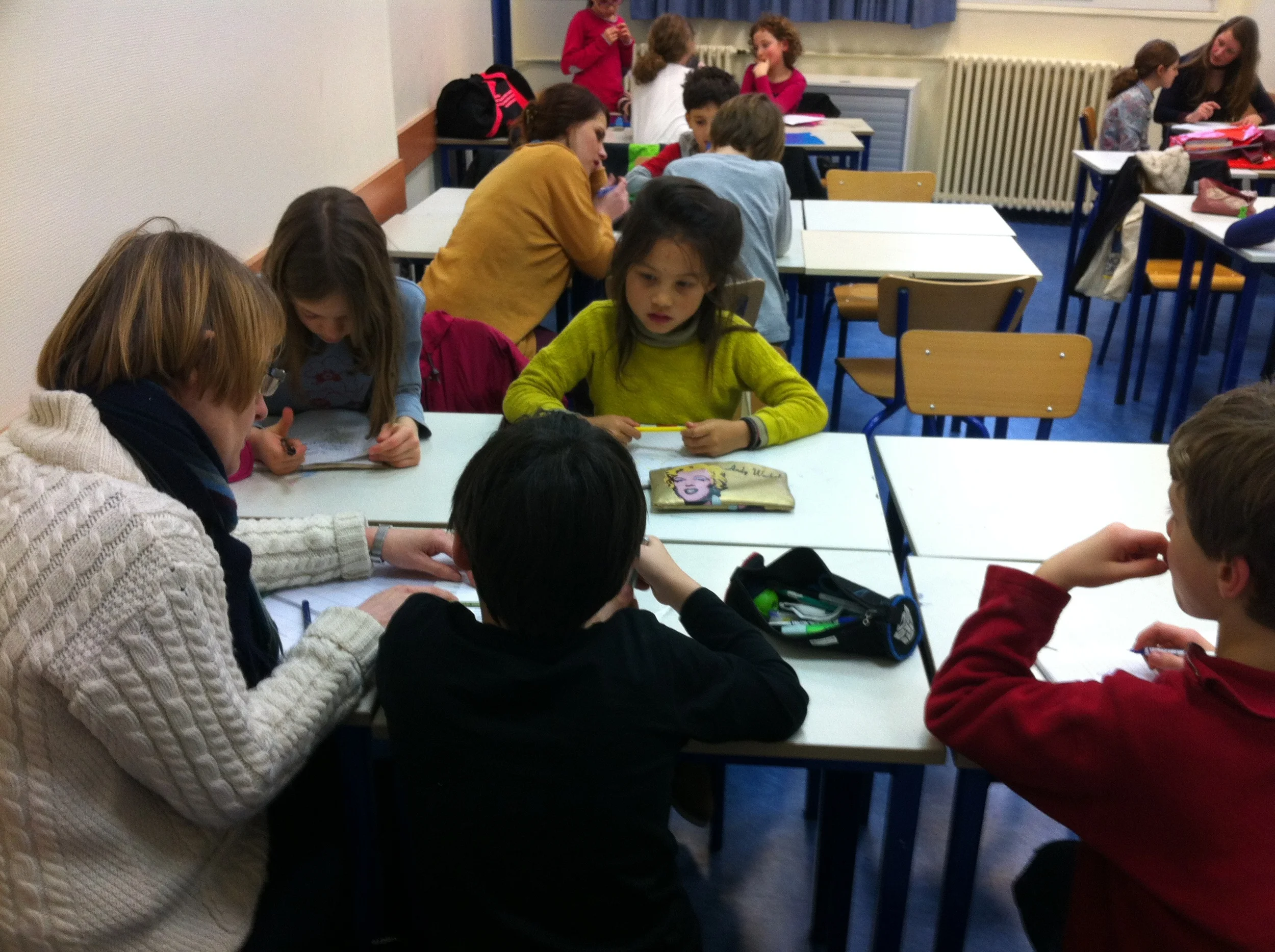 The hum of creativity is audible in the Writers' Workshop of Paris-based Roaming Schoolhouse .
