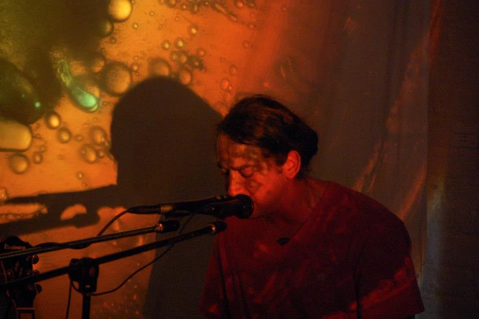 Jacob Economy Leonard performing live at Delurk Gallery during the Blue Moon Gallery Hop. 