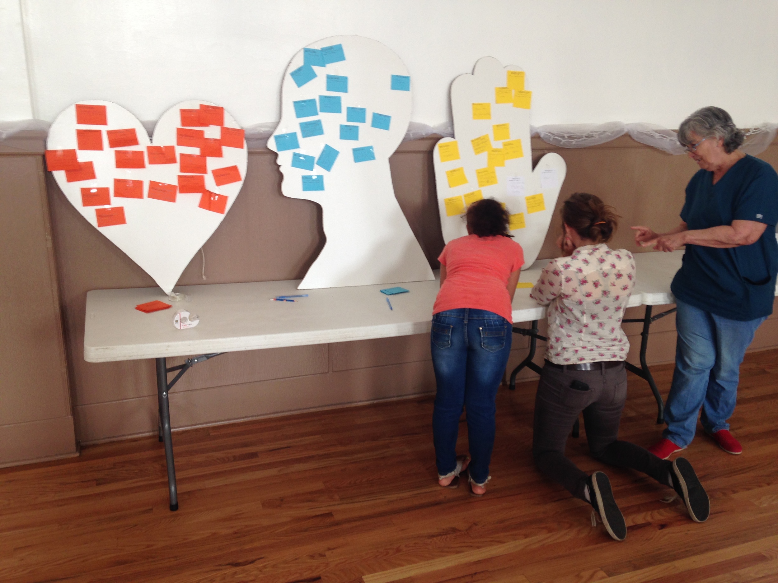 Anna, Michelle, and Elaine working on getting their gifts on the boards. 