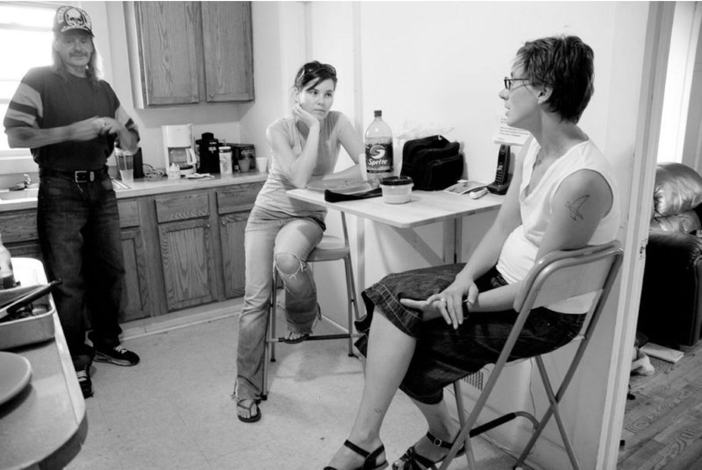 2008: A snapshot of daily life within the Boiler Room house with Jen discipling Sarah amongst the neighbors they had invited to live with them. 