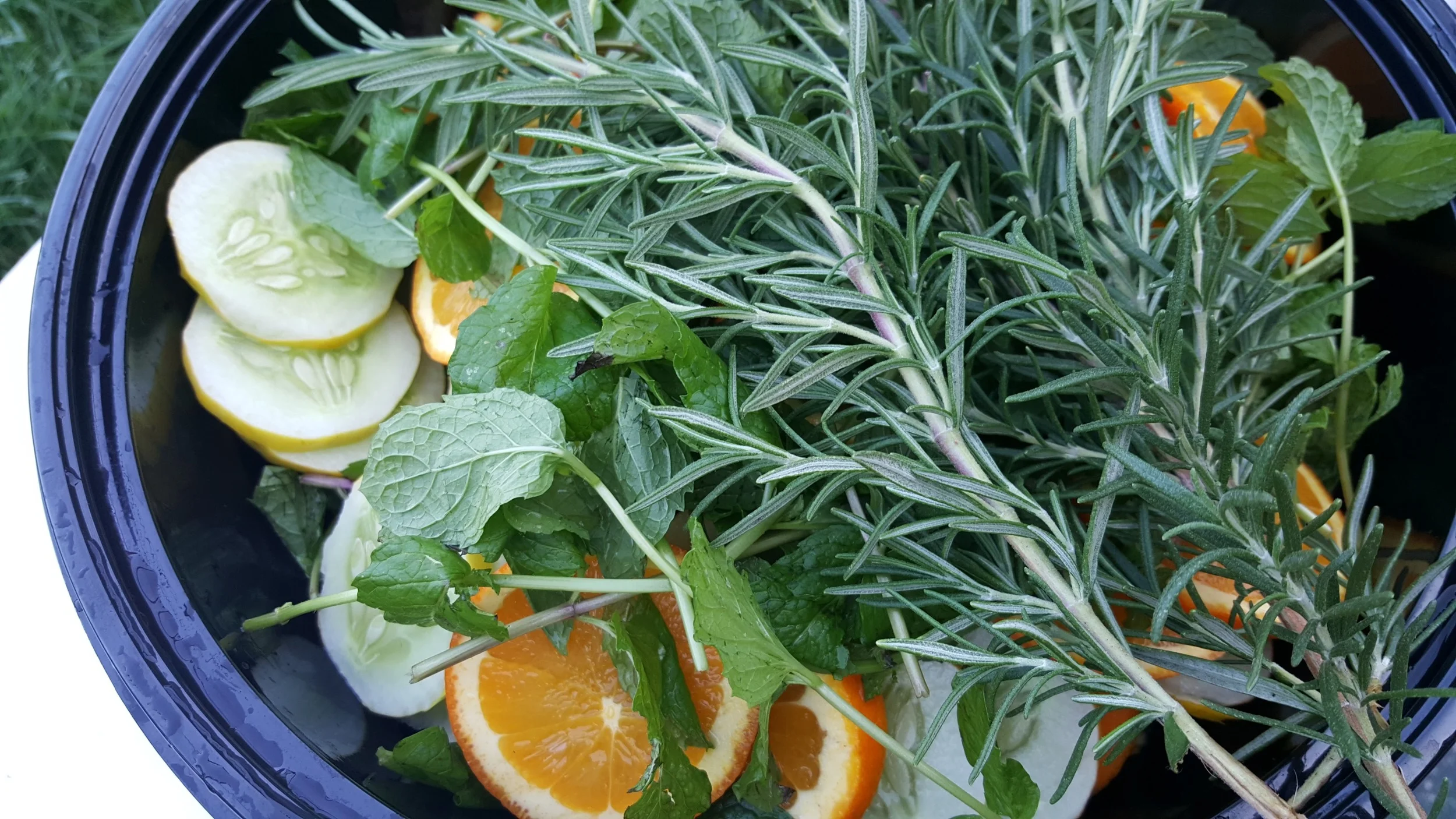 Fresh Rosemary, mint, white cucumbers (grown at #ThatRanch) and fresh oranges make up our summer cuke water.