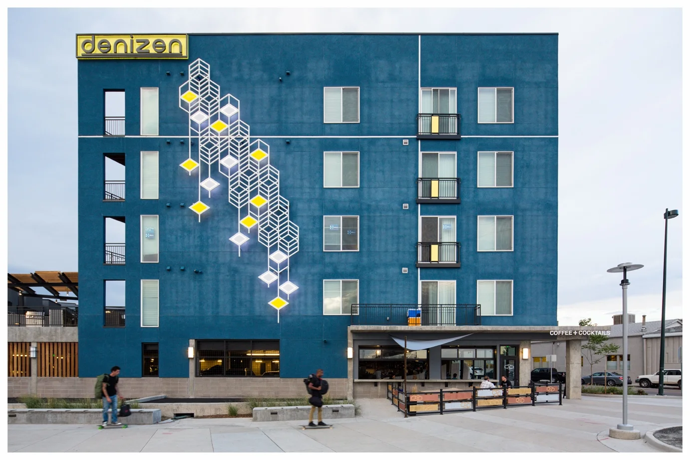 "Moving Right Along", (Day Time View)Rectangular aluminum tubing, paint, acrylic, LED light, 20x50', 2016, Denver. Image Credit:D4 Urban