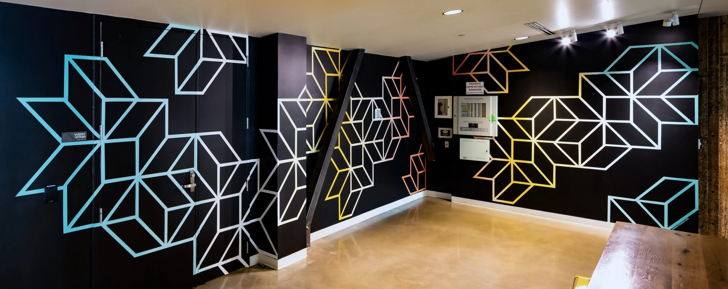 "Moving Through", Acrylic paint, 2 Walls: 8x22' + 9x12', 2021, Nichols Partnership/Galvanize Lobby, Denver, CO. Photo by: Travis Rummel