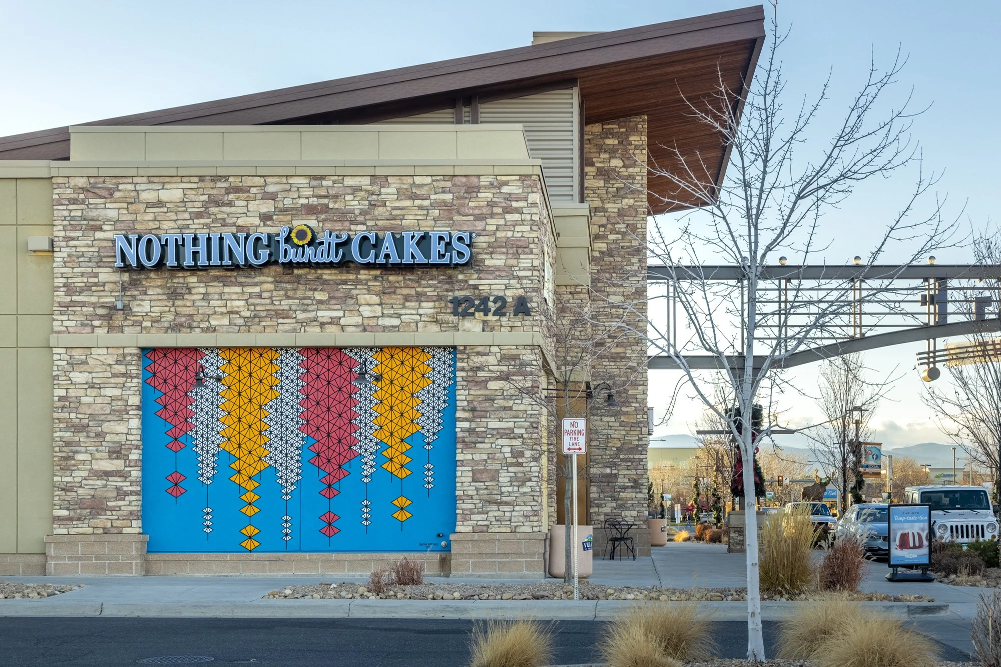 "We Can Make it Easy," 16'x10'5", Acrylic paint, Village at the Peaks, Longmont, CO, 2021. Photo by Third Dune Productions
