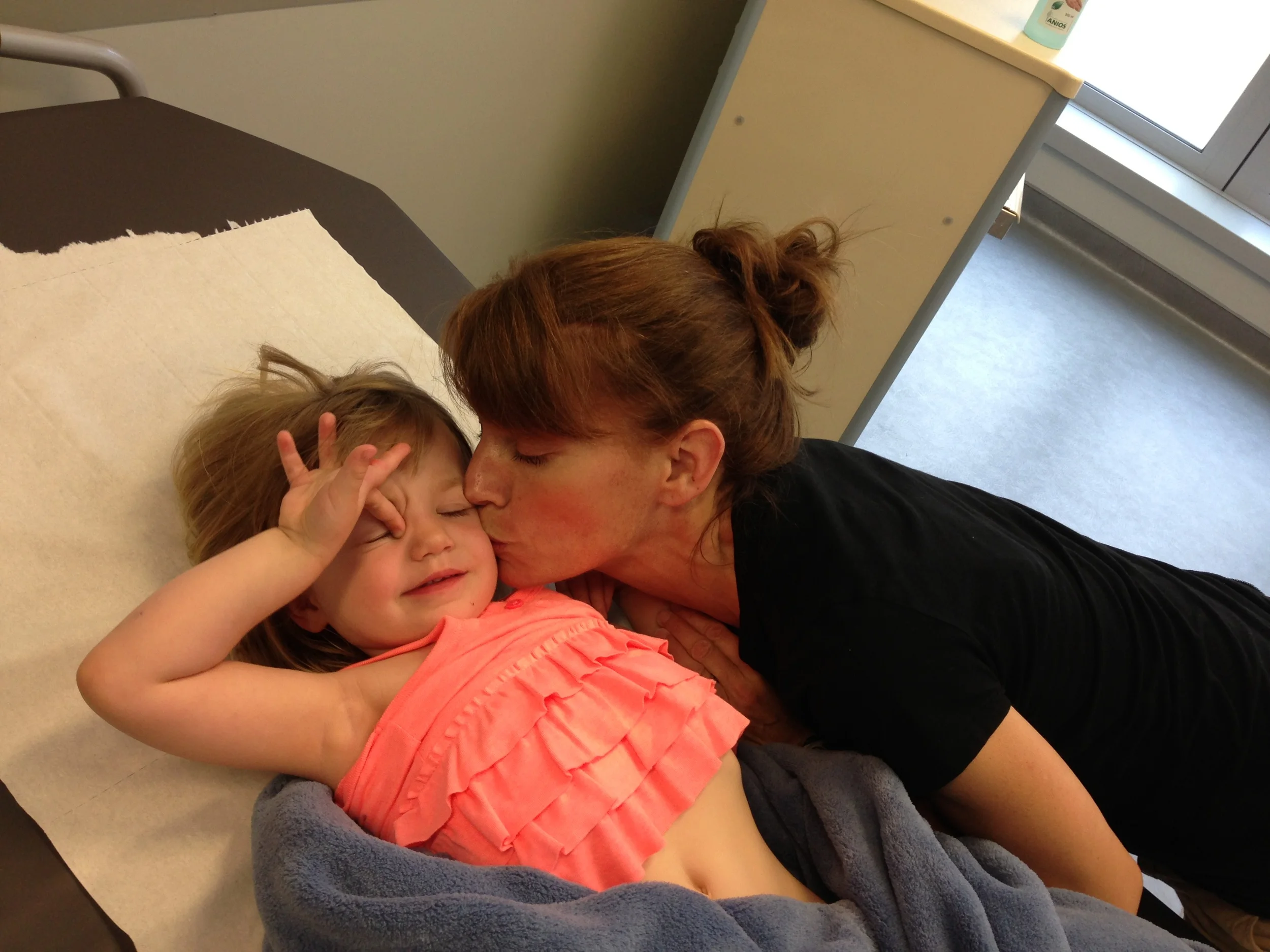 Giving my sweetie pie kisses in the hospital.