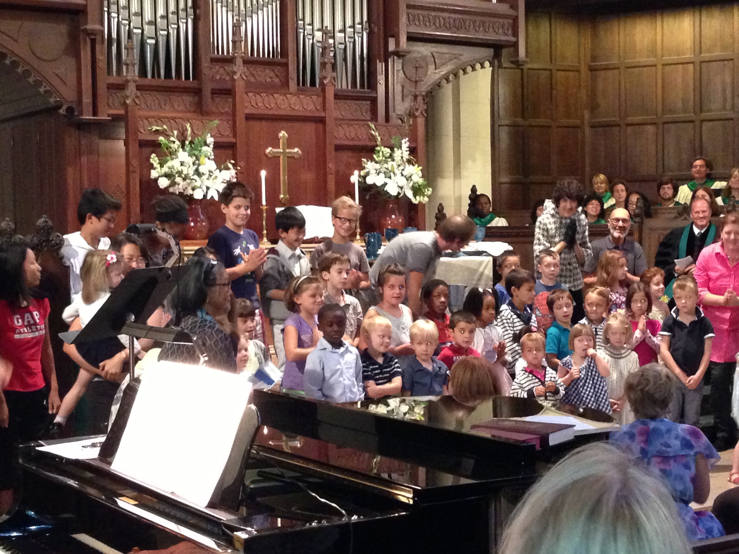 All the kids getting ready to sing at mass, see if you can spot Lance.