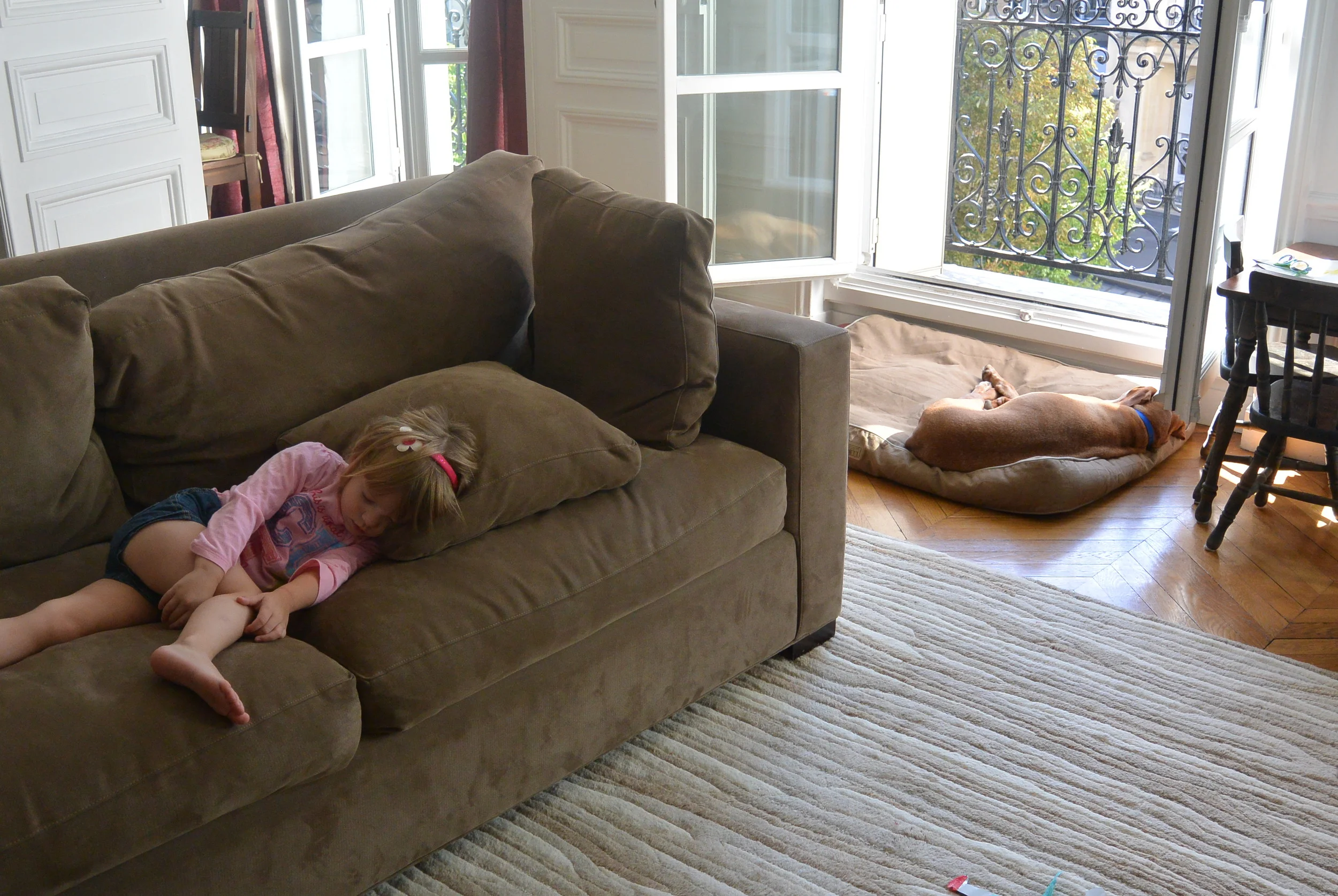 two tired kids (dog and child)