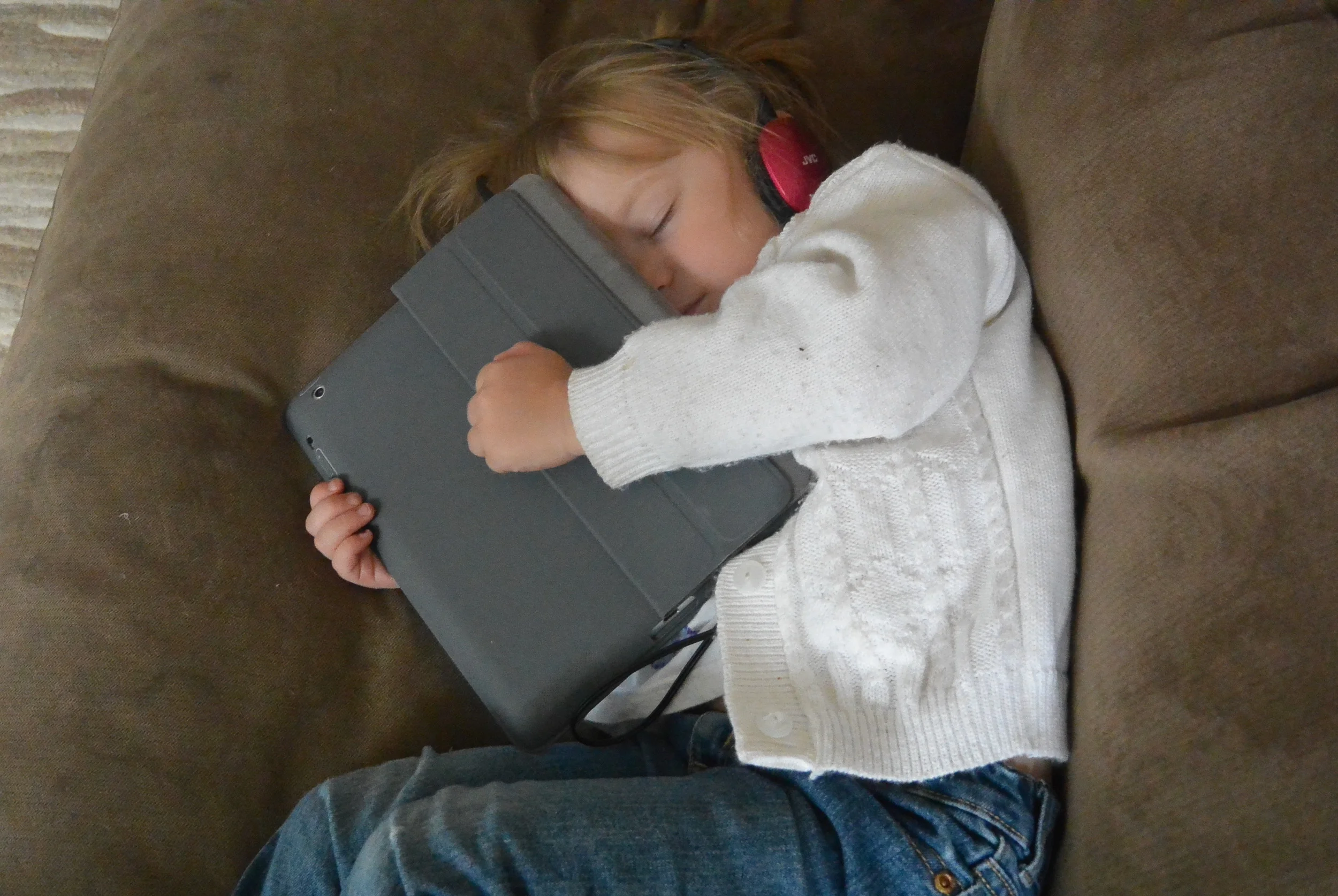 Do you think she is tired...won't let go of the ipad.LOL!