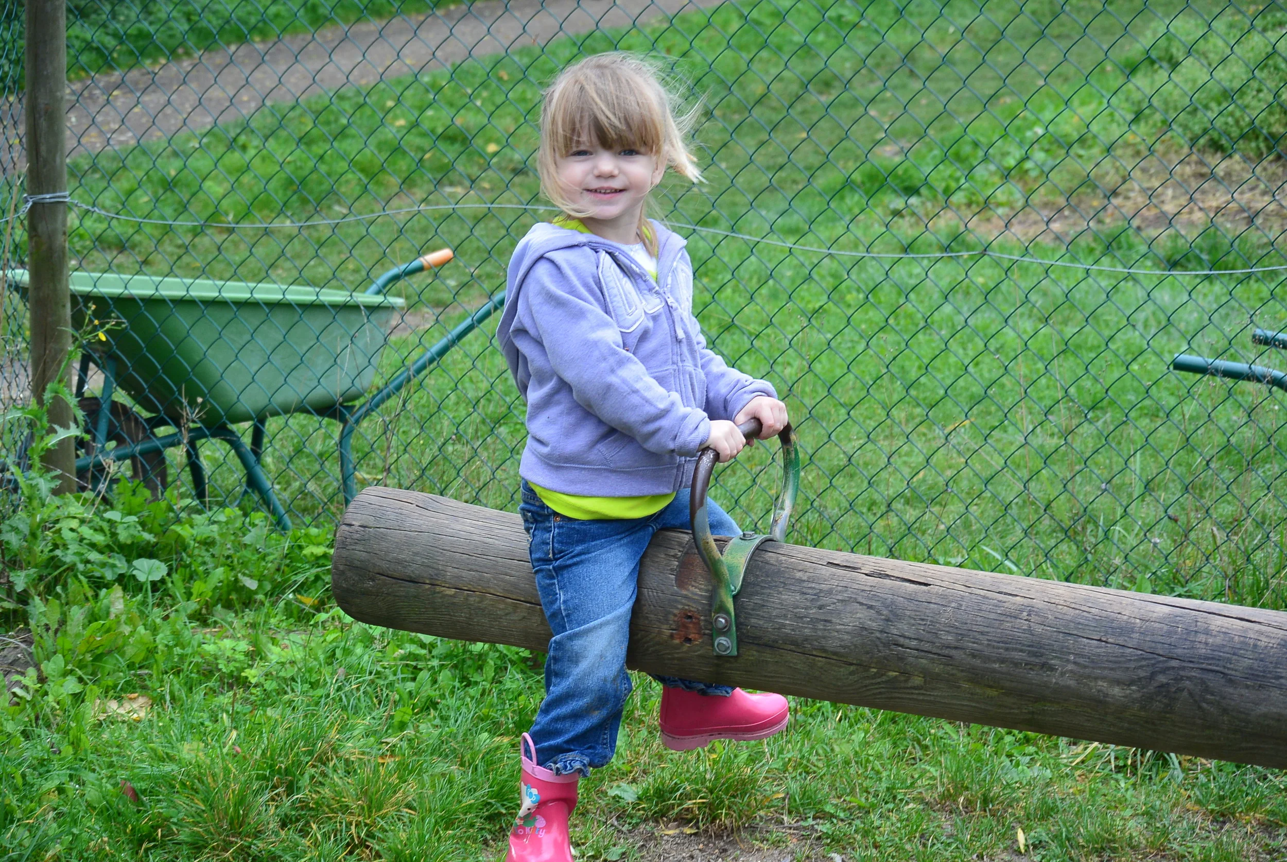 Peyton enjoying an old fashioned see saw.