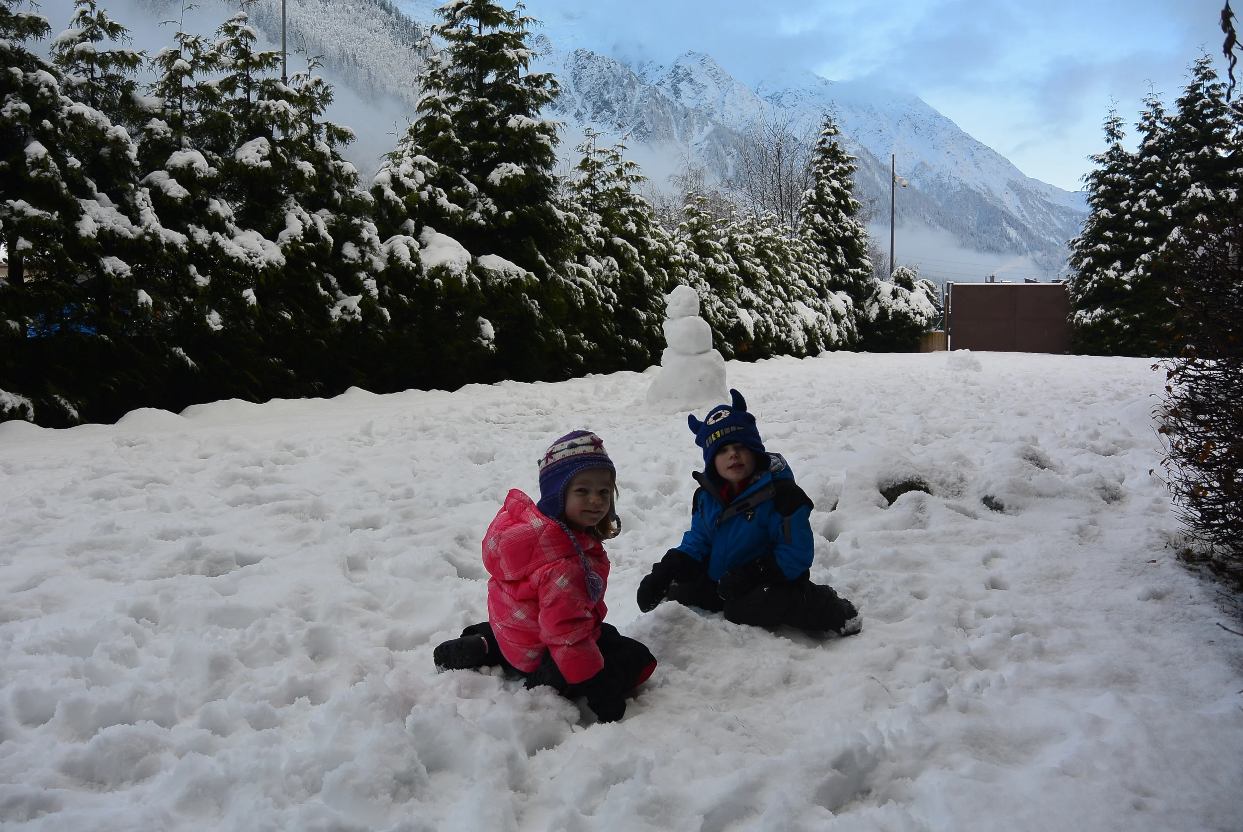 Kids enjoying the snow behind our room.