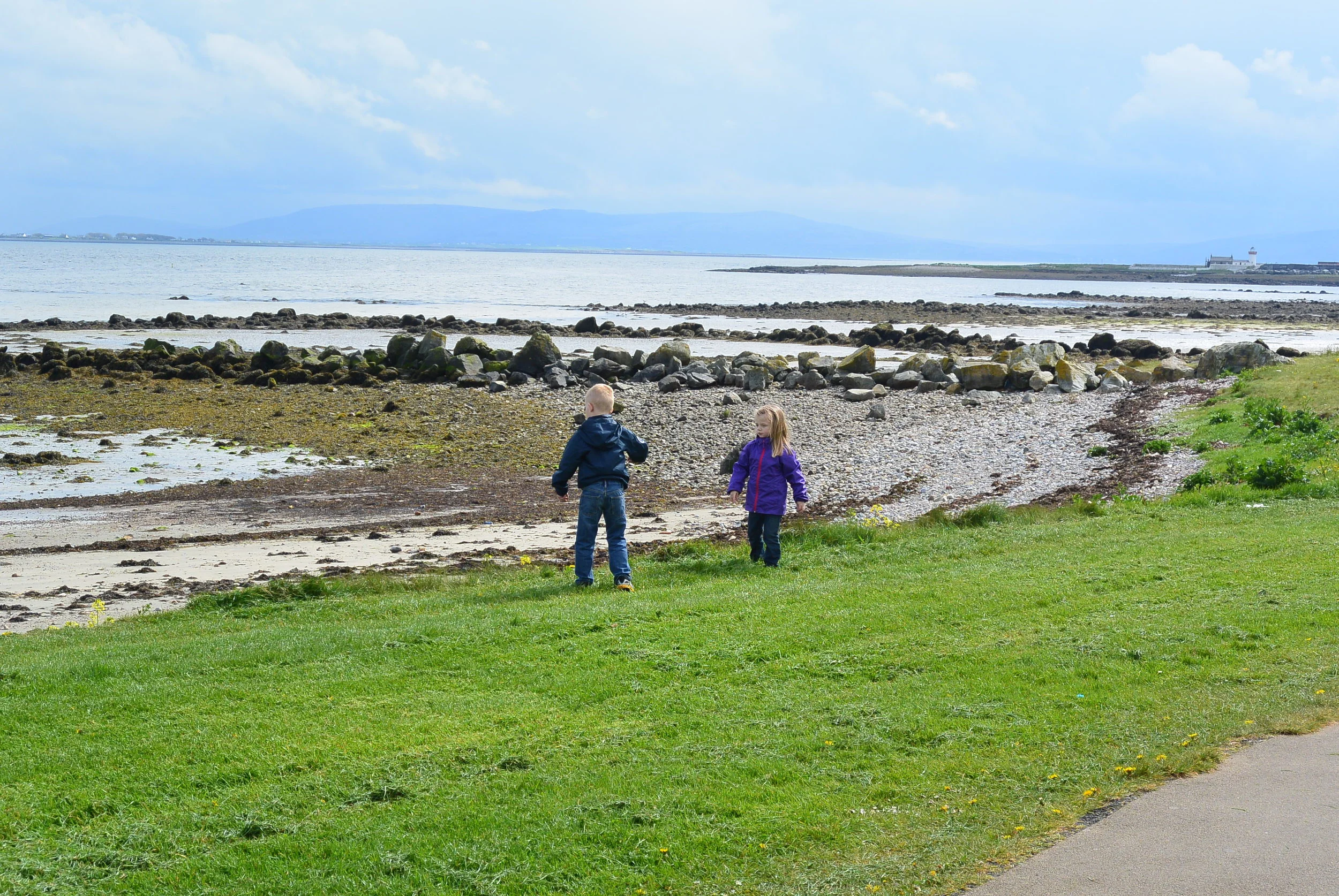 Kids enjoying the rock beaches of Galway! &nbsp;They could throw rocks in the water all day!
