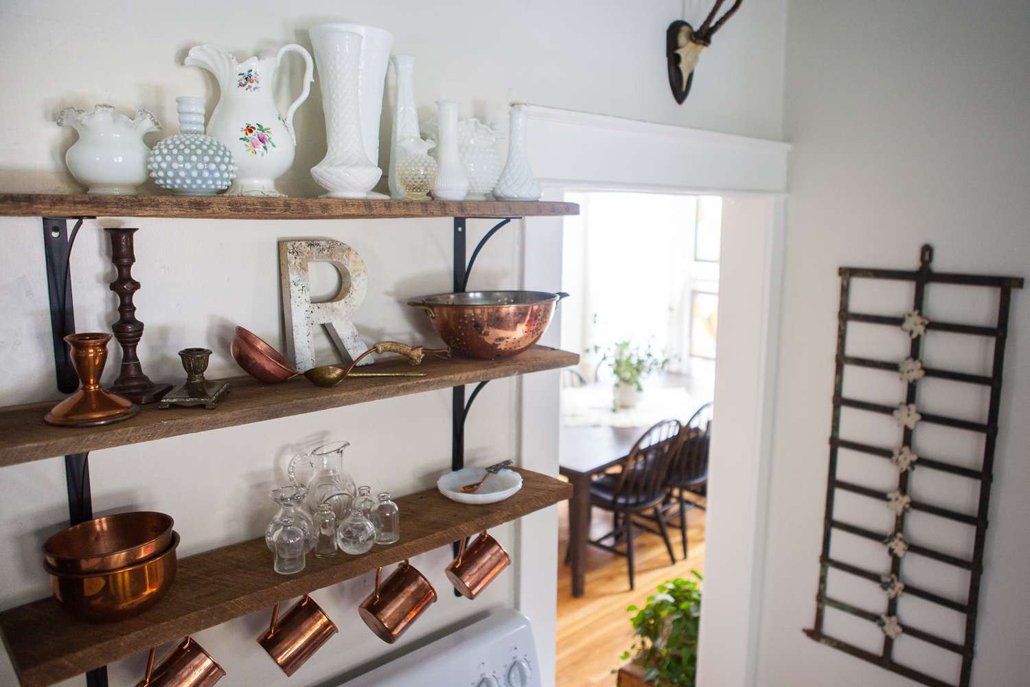 1. Personalize your space. Adding a personalized element to my space is probably the most important home essential to me. My grandmother collected milk-glass and my mom gave me her collection. These pieces are so special to me and I've added to her collection. I never knew my grandmother, but I'm told I got my creativity from her. She's my namesake. I also love collecting vases and copper. I've acquired these vintage pieces over time from antique malls, flea markets, garage sales etc. (The mugs are from Beam and Anchor in Portland) I display my collection on old barn wood shelves in my kitchen. 