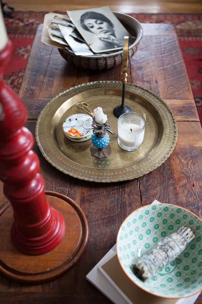 3. Pieces that keep me connected to my home and heritage. This coffee table was one of the last gifts my papa gave me before he passed. He had it made for me with wood from an abandoned shack in Louisiana, my home state. The bowl is filled to the brim with old pictures of people and moments I love. That's my beautiful mama on the top. People are more likely to flip through photos when they are sitting out. I also love having yummy smelling candles burning in my home at all times. One of my favorite candles was made by a dear friend, Travis, who owns Manready Mercantile . 