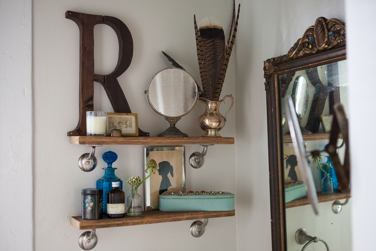 4. Even your restroom can be a place to display pieces which are special to you. The restroom can be beautiful and functional. I try to decorate with pieces that have a story and mean something to me. Every item on these shelves tells a story. The R was a house warming gift from my precious friend, James, of Handy Andy Productions . Since I love giving and receiving personalized gifts, this letter meant so much to me. I love my wooden initial! James finished it off with copper nails because he knows how much I like copper! 