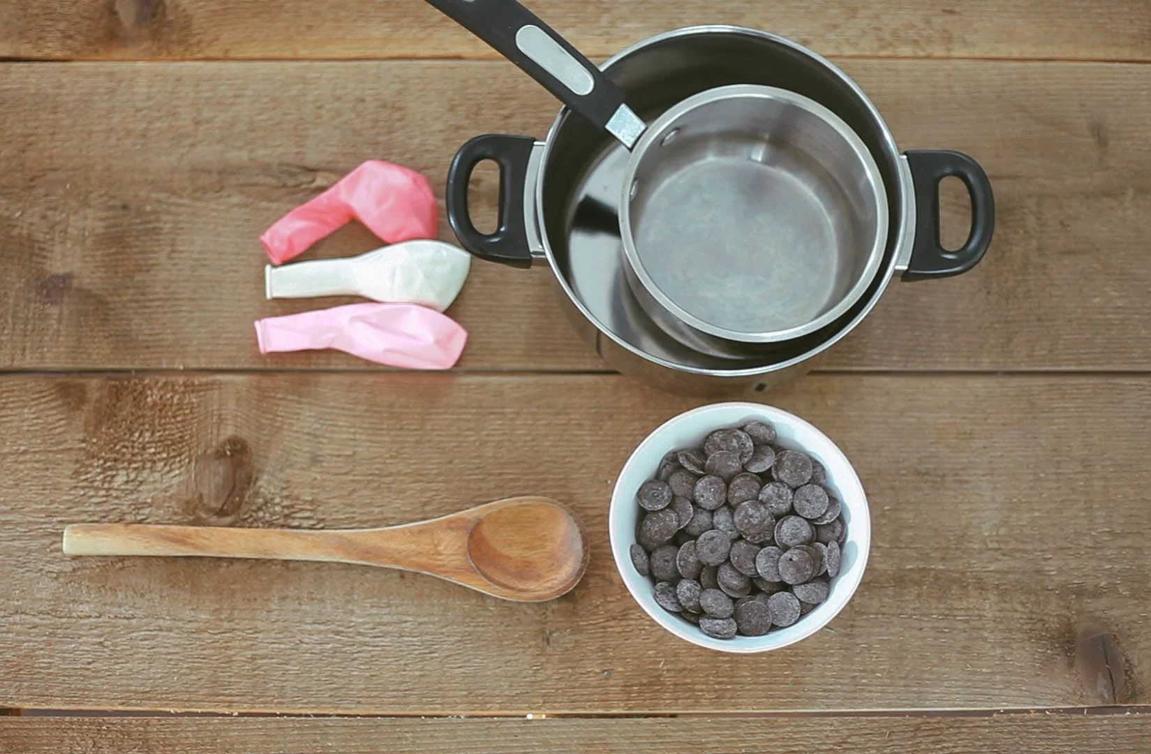Supplies you will need: - Small balloons, melting chocolate, a double boiler, spoon for stirring, water.