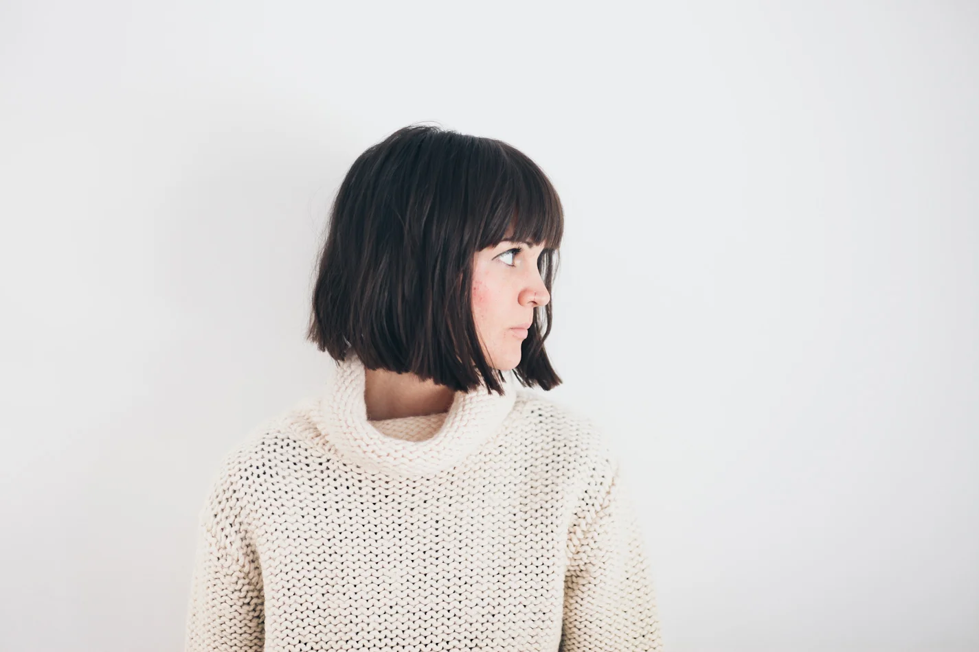 Ok guys, I have had bangs for a long time. I love them. I usually try to grow them out after a few months, but then I'll watch one episode of New Girl and you'll find me in my bathroom late at night bringing them back to life (which I do not recommend, call your hairstylist!) I think I'm just doomed to always have them, I did successfully grow them out in 2012 and went an entire year without them, that was fun, and it'll happen again one day, but until then, here are a few tips I've learned along the way to help maintain keeping your bangs looking fresh and deceptively clean. Blow dry! I always find when I blow dry my bangs on a high heat after washing them, they stay fresh longer. If I let them air dry, they tend to get greasy a lot faster. When you blow dry them, use a brush or a comb and blast them all to the left, then to the right, then down, and keep repeating this until they are dry. Dry Shampoo . My best friend. This saves me, because your bangs are sitting on your face, they get greasy a lot faster than the rest of your hair, dry shampoo absorbs the oils and lets you go an extra few days of keeping them looking thick and fresh. * I recommend this one >> click here << my absolute favourite. I use the "Hot Chocolate," which I love because it's for brunettes! No Touching. Try your hardest to keep your hands off. Your bangs do not like the natural oils on your hands! Hairspray. Get a good, medium-firm hairspray. This helps me a lot. It's always the last thing I do before I walk out the door, use a comb to style your bangs to your liking and then give them a good spray, not too much, but it keeps them in place and then it helps you keep your hands off too. Wash. My bangs can go about 4 or 5 days without needing a wash. This does change with the seasons, as the Summer can be hotter and more unpredictable. And some people can't go more than a day without washing them. One thing that has saved me, especially when i had long hair that could go a week without washing is to tie all of your hair back into a tight bun keeping separate your bangs and any front pieces that feel greasy and just wash the front part. It's easy to do in the sink and just takes a minute. Blow dry and you're good to go! Trim about once a month. I've learned this lesson far too many times, that it's really the best decision to get someone else to do this. It doesn't take long, and most salons do it for under $10 or if you go back to whoever did it the first time, they will sometimes give you a free bang trim. If you are like me though, and get those spur of the moment urges, don't just grab a pair of kitchen scissors and hack away. Buy a proper pair of hair cutting scissors and take your time. Pull the rest of your hair back, and follow the exact line of your bangs, use a comb, don't wet them, and don't try and give them a new shape. Don't cut them strait across, start at the centre, hold your scissors at an angle, pointing upwards, and cut at short, small increments moving outwards. Again, I don't suggest you do this, but if you do, don't rush it! If you're having days where they just won't cooperate, try parting your hair really far to one side and braiding it across the front, or use a pin or clip to cover them with a drastic side part. (Tutorial coming soon!) I hope you found this helpful, and know that I'm no pro, but these are a few things that have helped me out through my many years of blunt bangs! If you have any other questions or suggestions, please comment below, we love your feedback! // Tegan //
