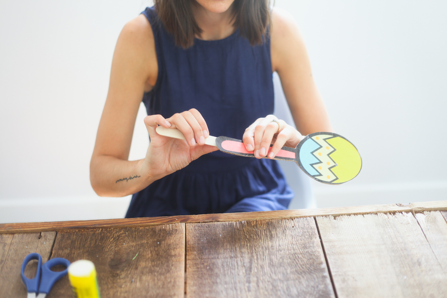 Step 4: Glue a popsicle stick to the end for holding. 