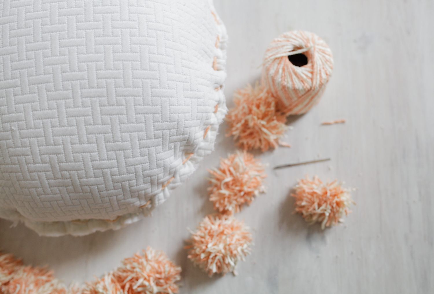 circle pom pom pillow