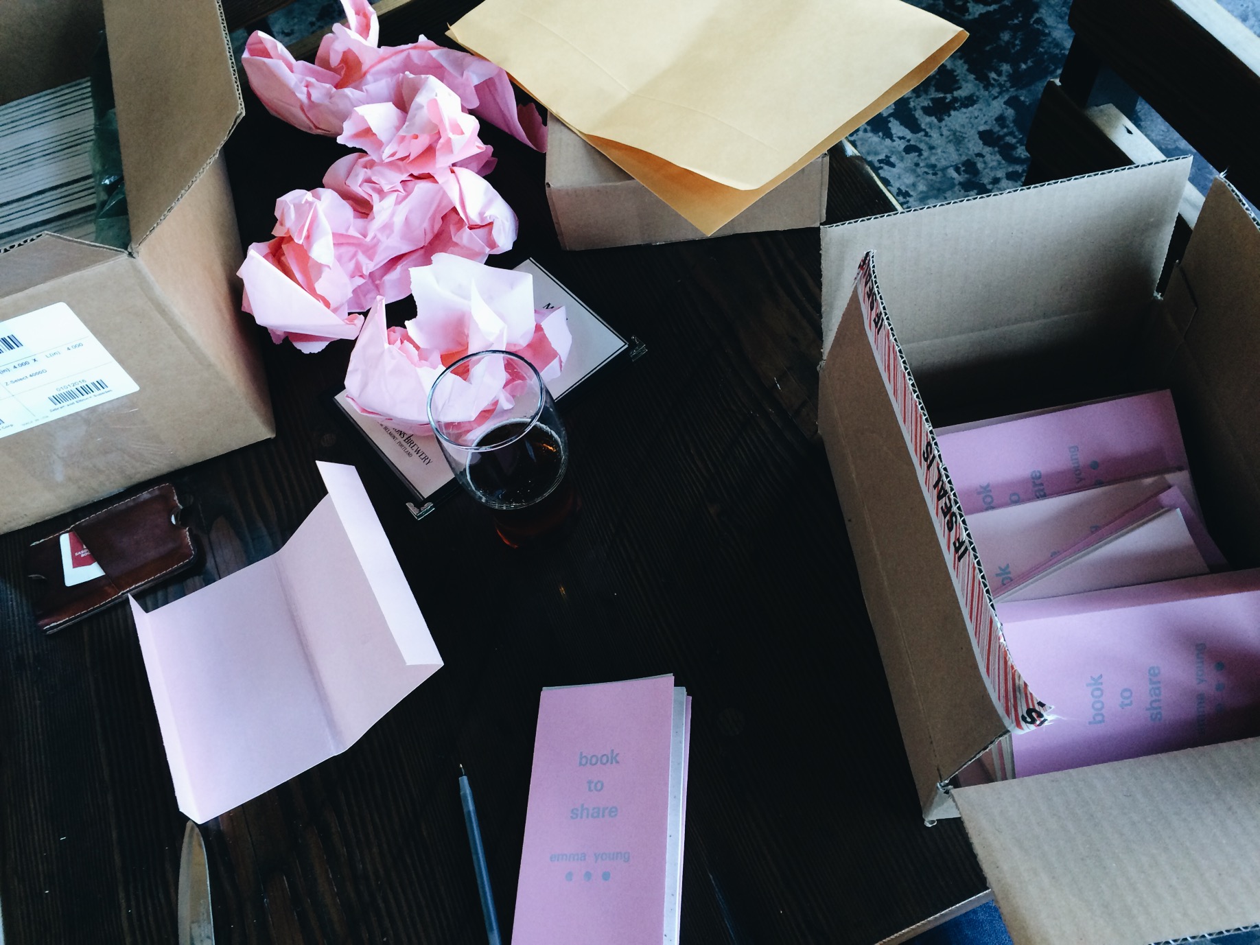 Packing books for author Emma Young, with packing paper pleasingly matched to her covers. 