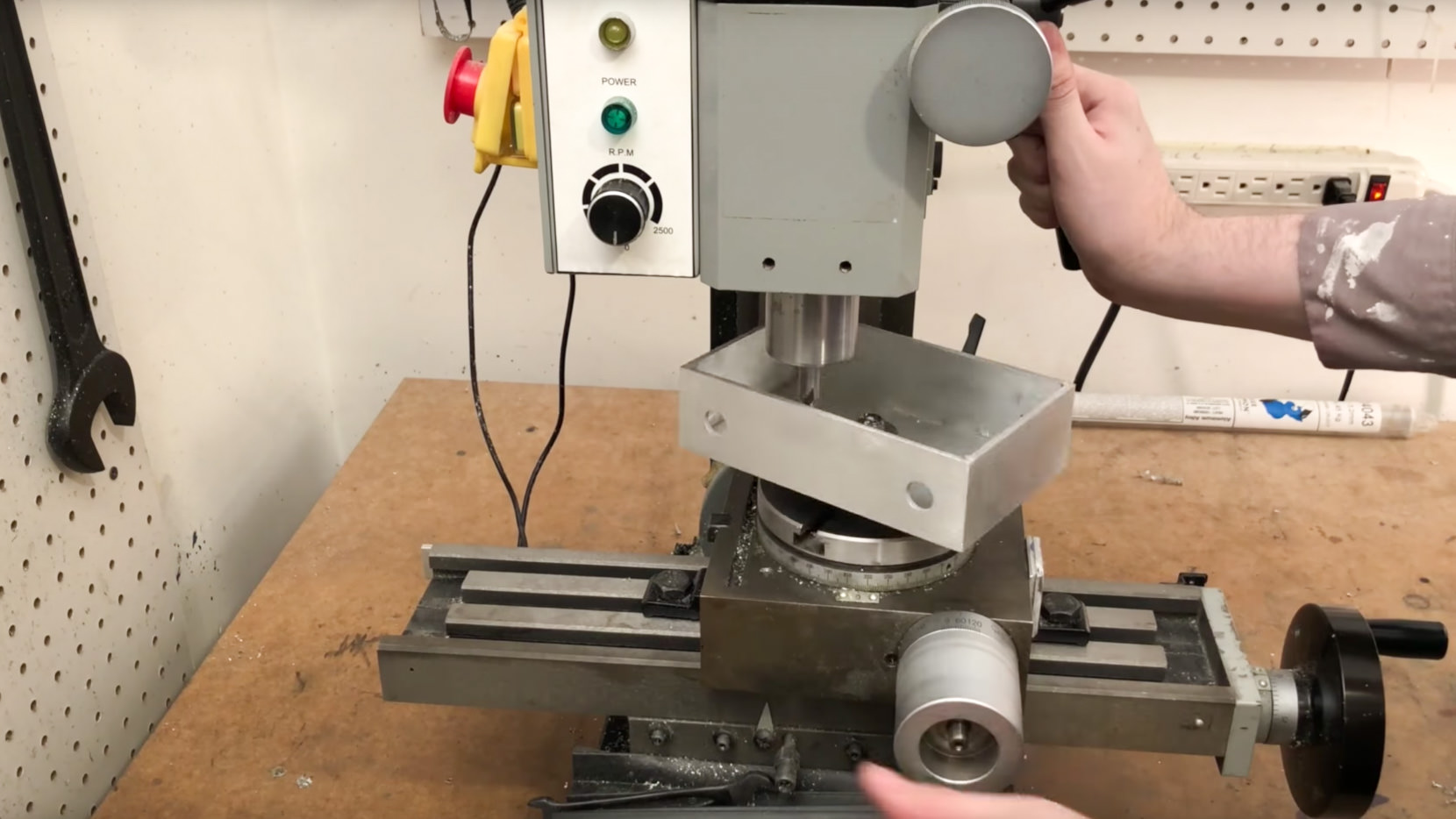 I use a rotary table on my mill to cut a bit hole in the middle.