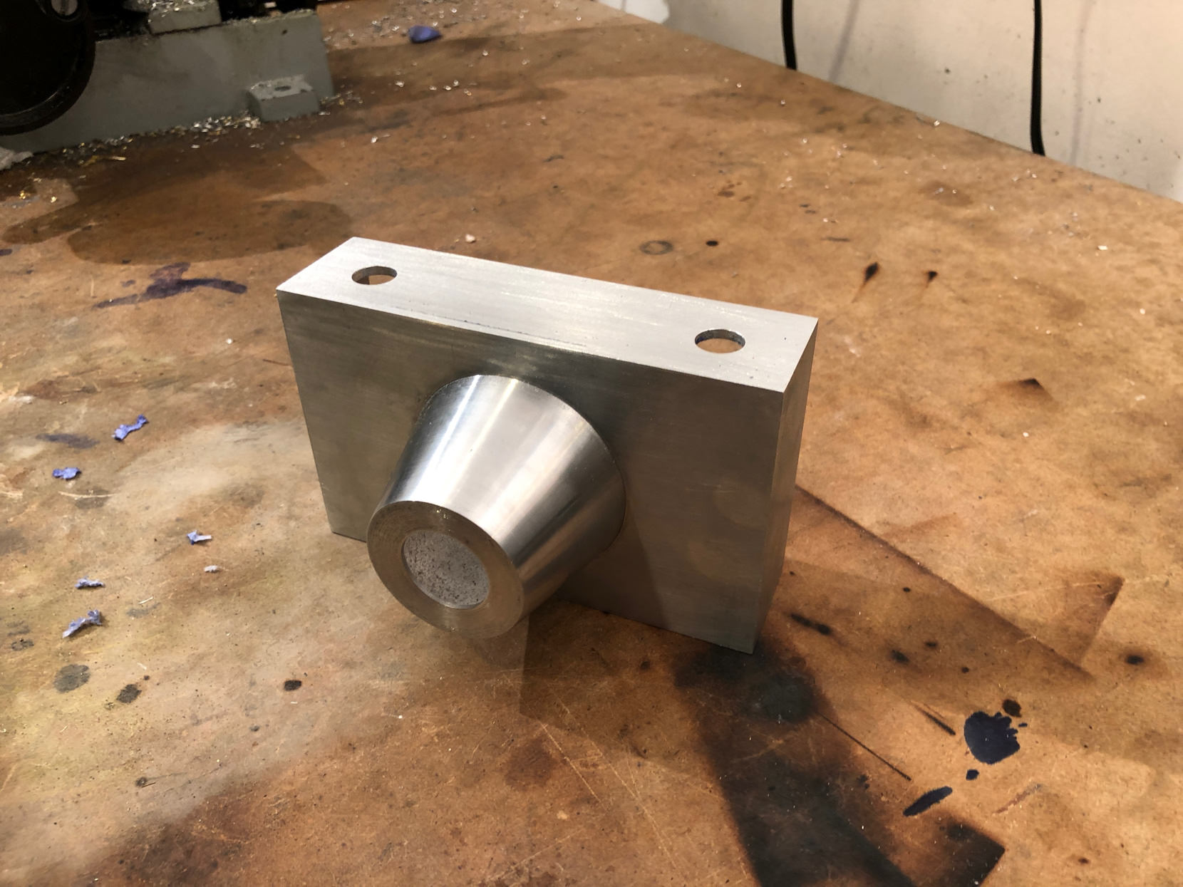 The cone is a press fit in the hole. Nothing but friction. I heat the body up to make it expand slightly and I freeze the cone to make it shrink a bit. when they are but together they temperature equalizes and they become permanently bonded.