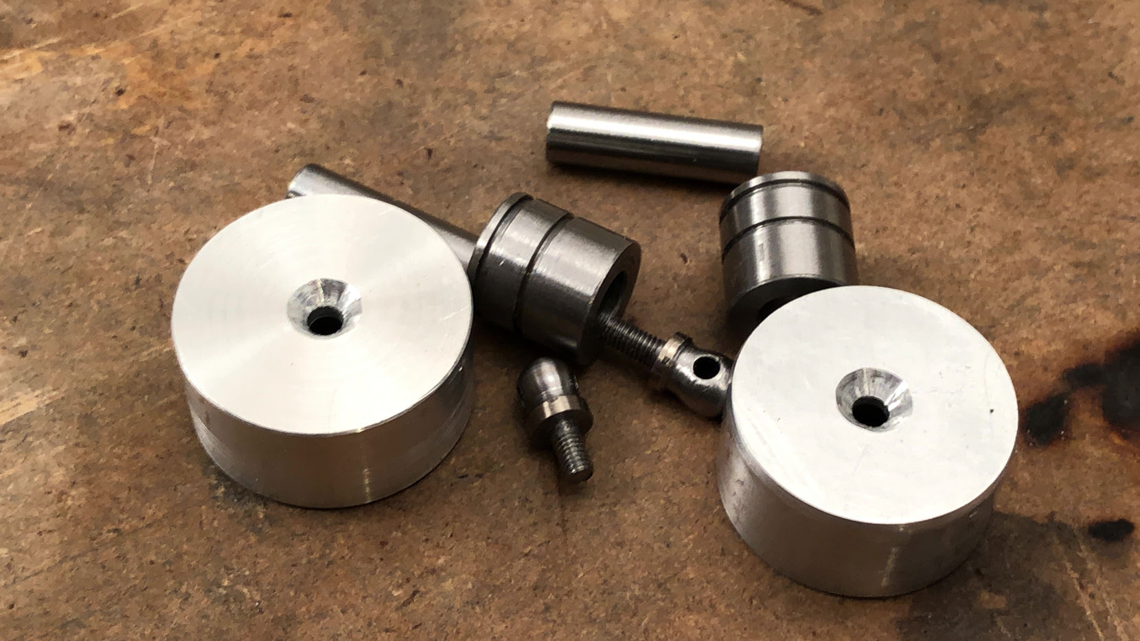 I make lots of small pieces of hardware. Including shafts, bushings and the camera strap mounts.