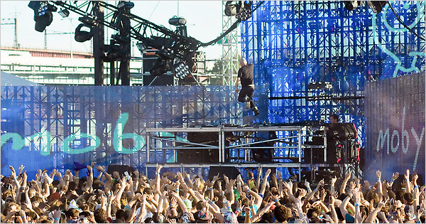 The D.J. Moby delivers his set to an arm-waving crowd at the Electric Zoo dance festival on Randalls Island. The event was sold out on Saturday and Sunday. Credit Willie Davis for The New York Times