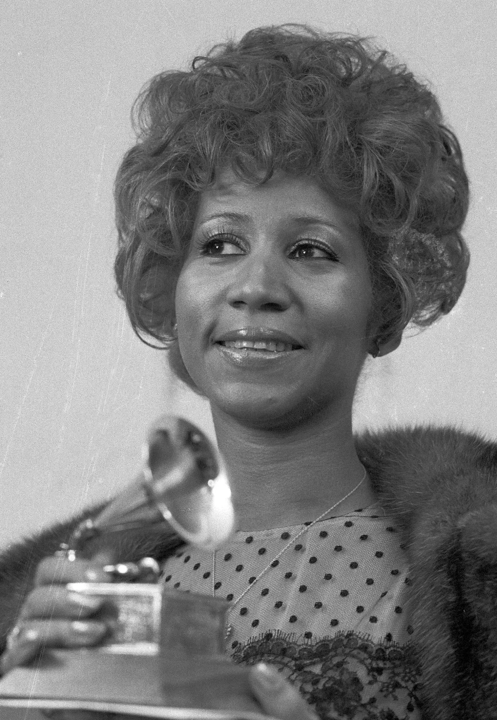 Grammys (1972) Aretha Franklin holds her Grammy Award trophy for Best Rhythm and Blues performance of the song “Bridge Over Troubled Waters.” AP PHOTO/DAVE PICKOFF