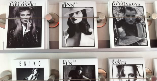 Wall of model comp cards at Elite Paris | Elite Model Look