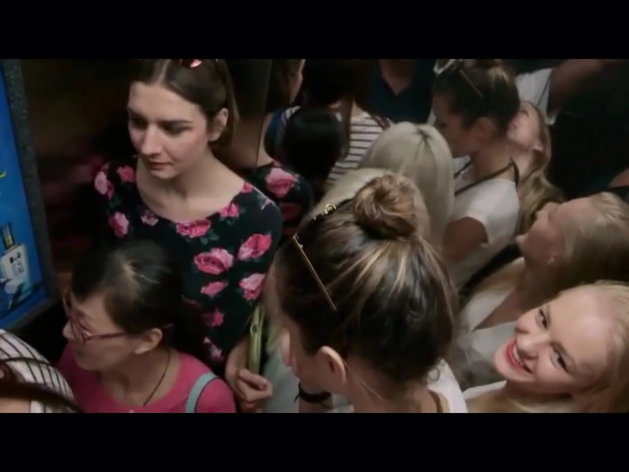 Models cramped in an elevator on the way to a casting | Still from Siberian Supermodels