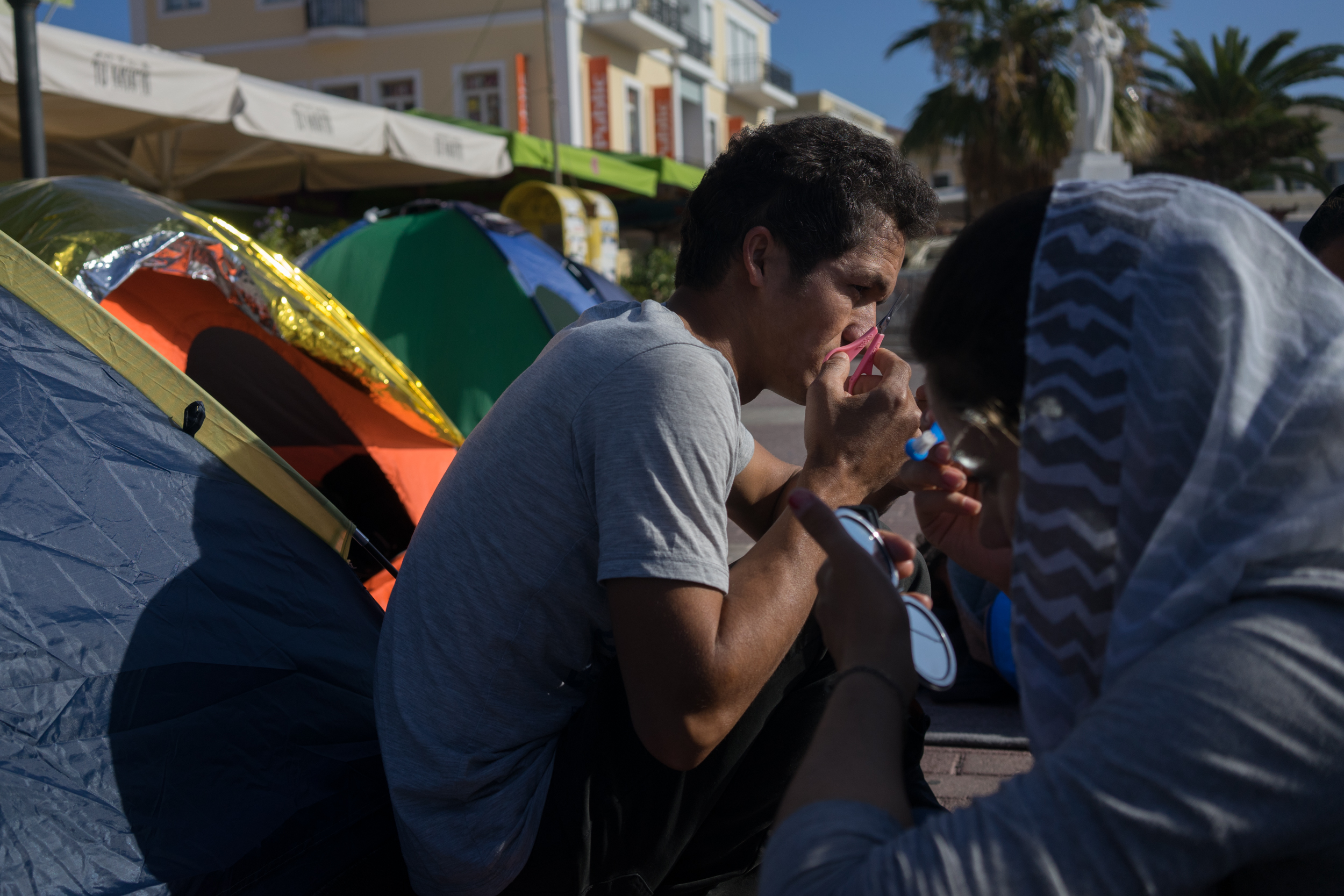 November 10, 2017. Sappho square, Mytilene, Lesbos, Greece. Kerim and Adele getting ready for the day in their protest camp in Sappho Square.
