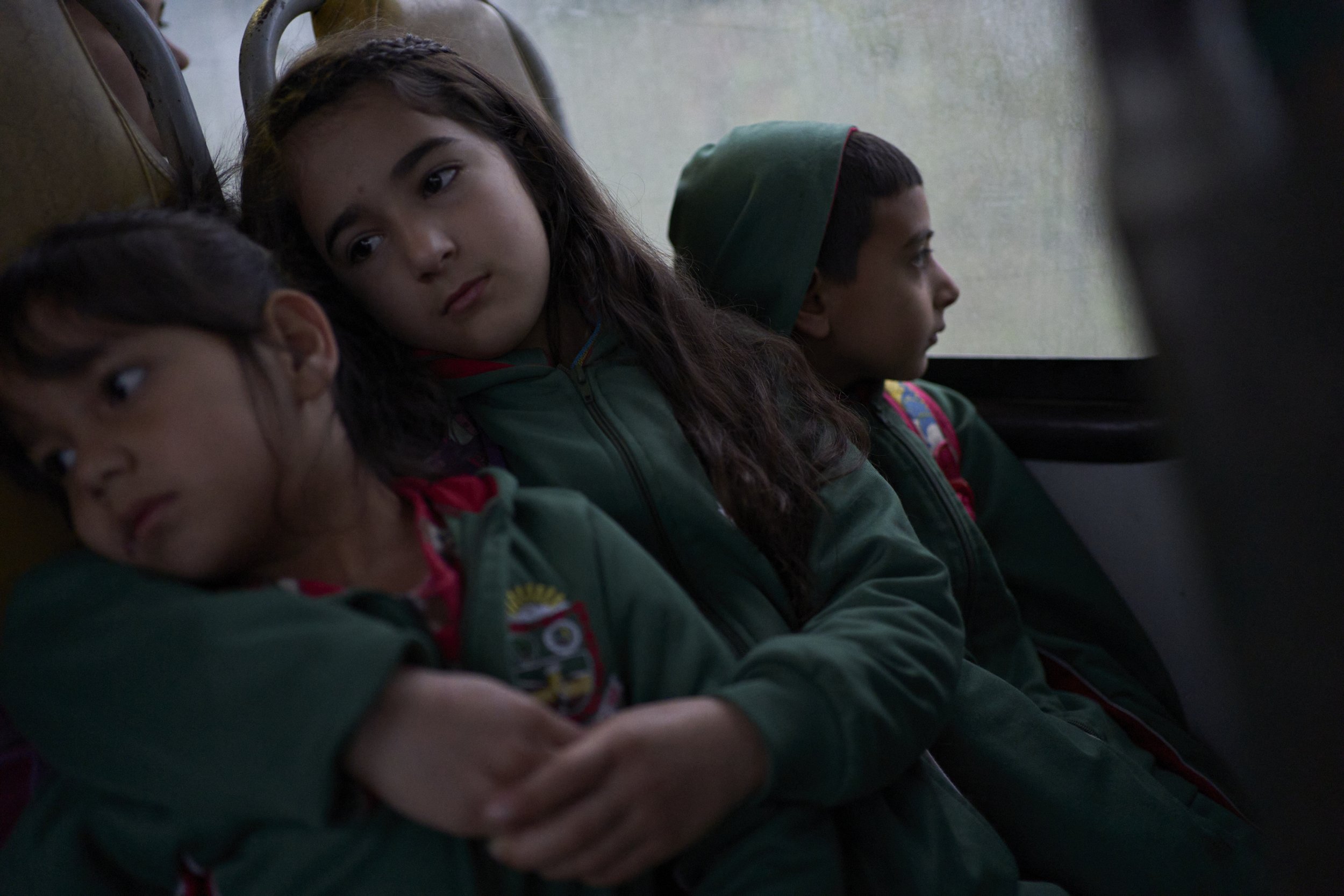 Yara Carolina Conlam Lerlonda and Emanuele Victoria Pereira de Jesús on their way to school. The bus gets them and other Xokleng kids at the Ibirama-Laklãnõ Indigenous Territory and non indigenous kids outside the territory.