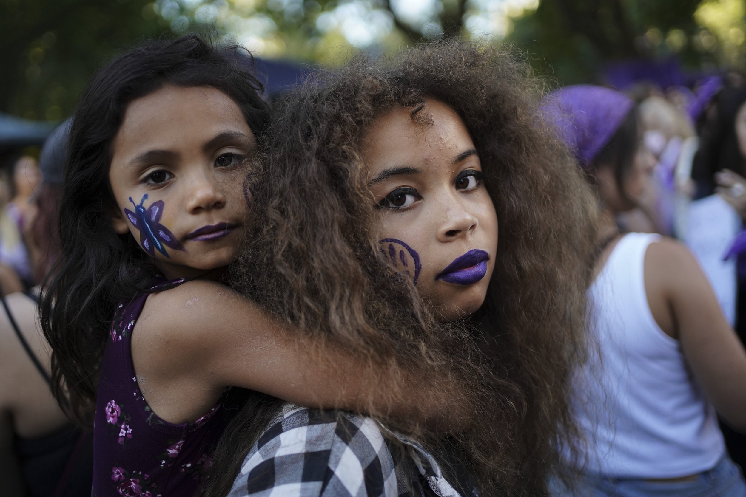 Sisters attend a march on International Women's Day, in Montevideo, Uruguay March 8, 2022. REUTERS/Mariana Greif